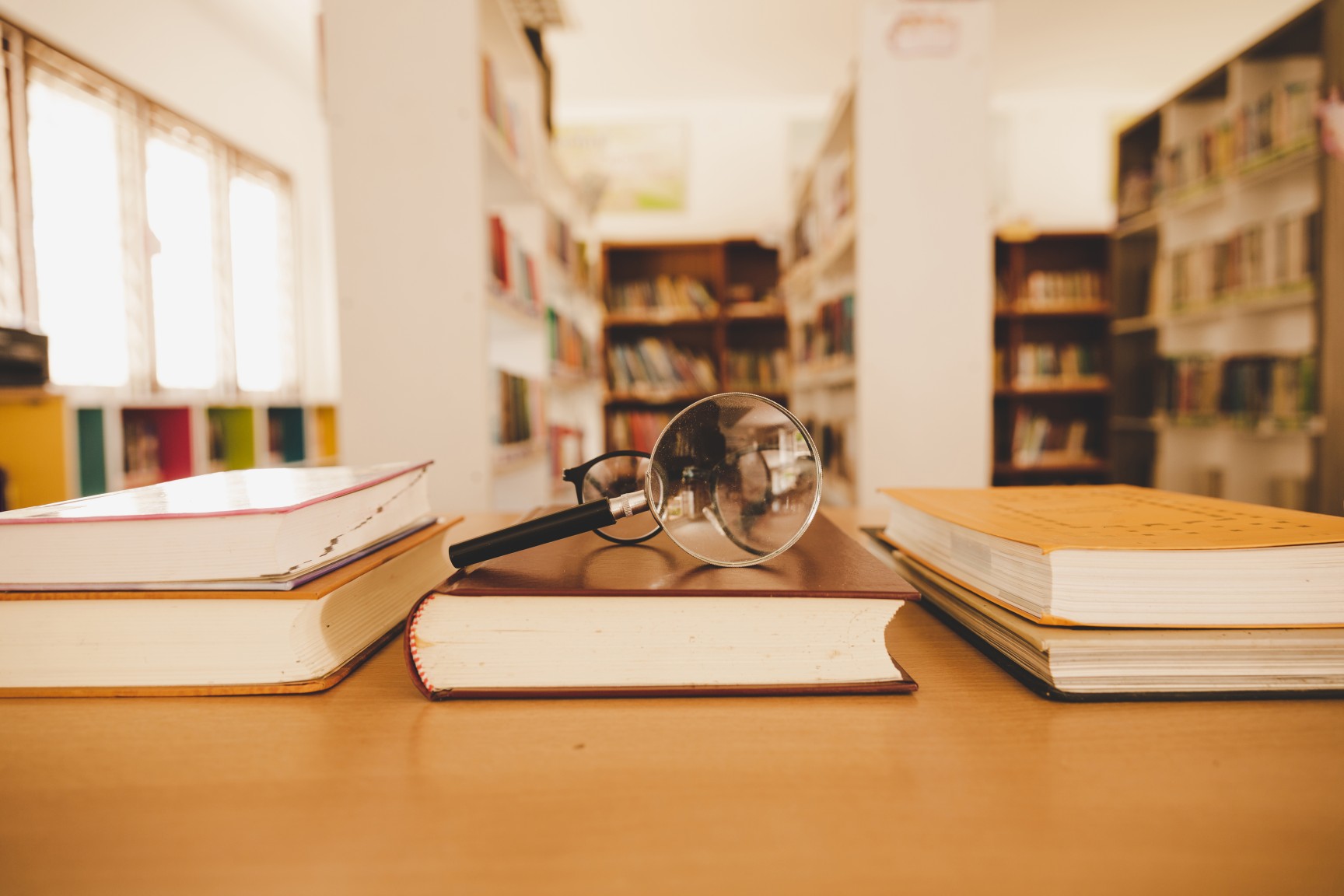 book library with old open textbook stack piles literature text archive reading desk